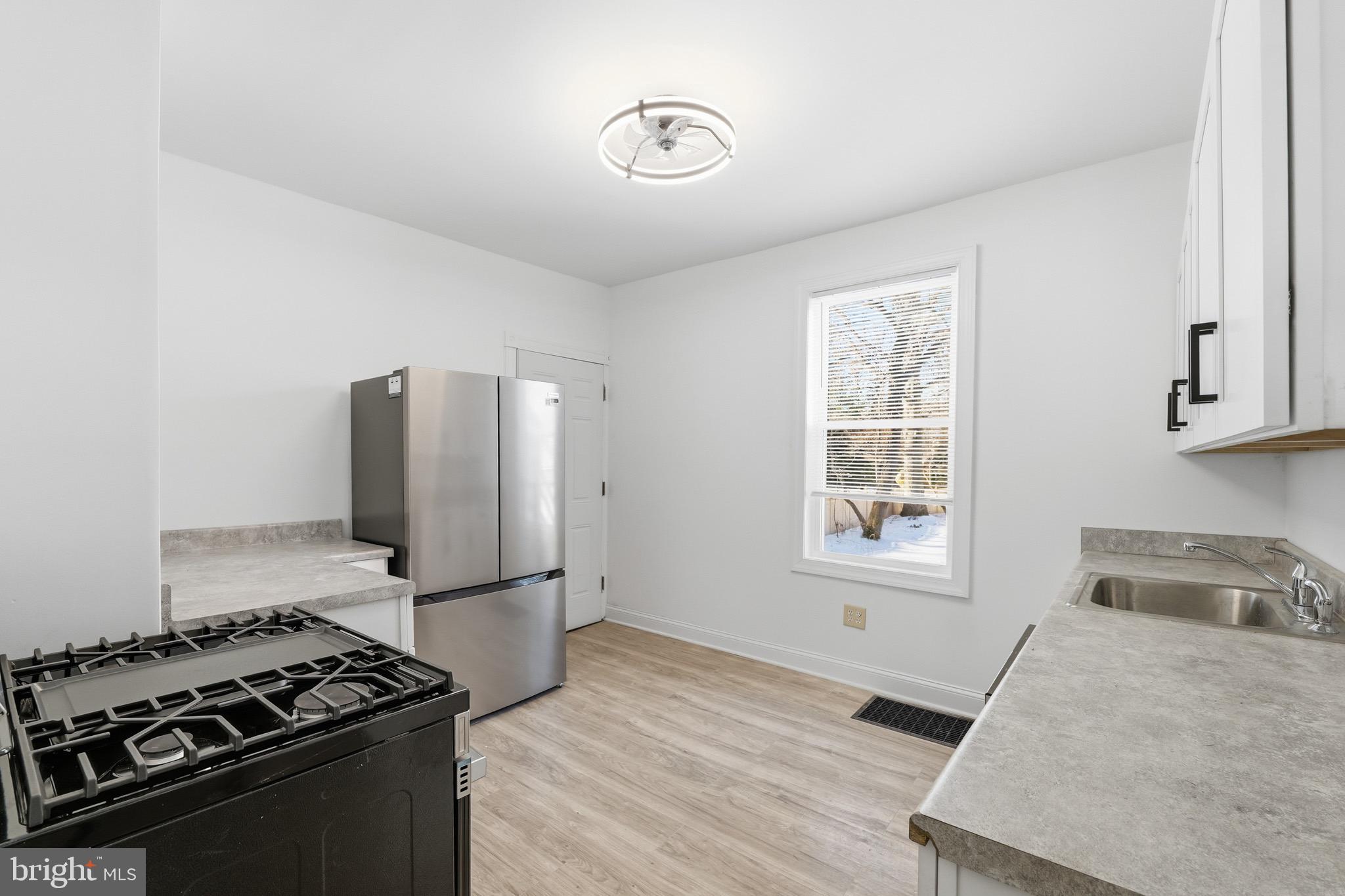 357 West 2nd Street Moorestown, NJ 08057 - Photo 21 of 23 a kitchen with granite countertop a stove and a refrigerator