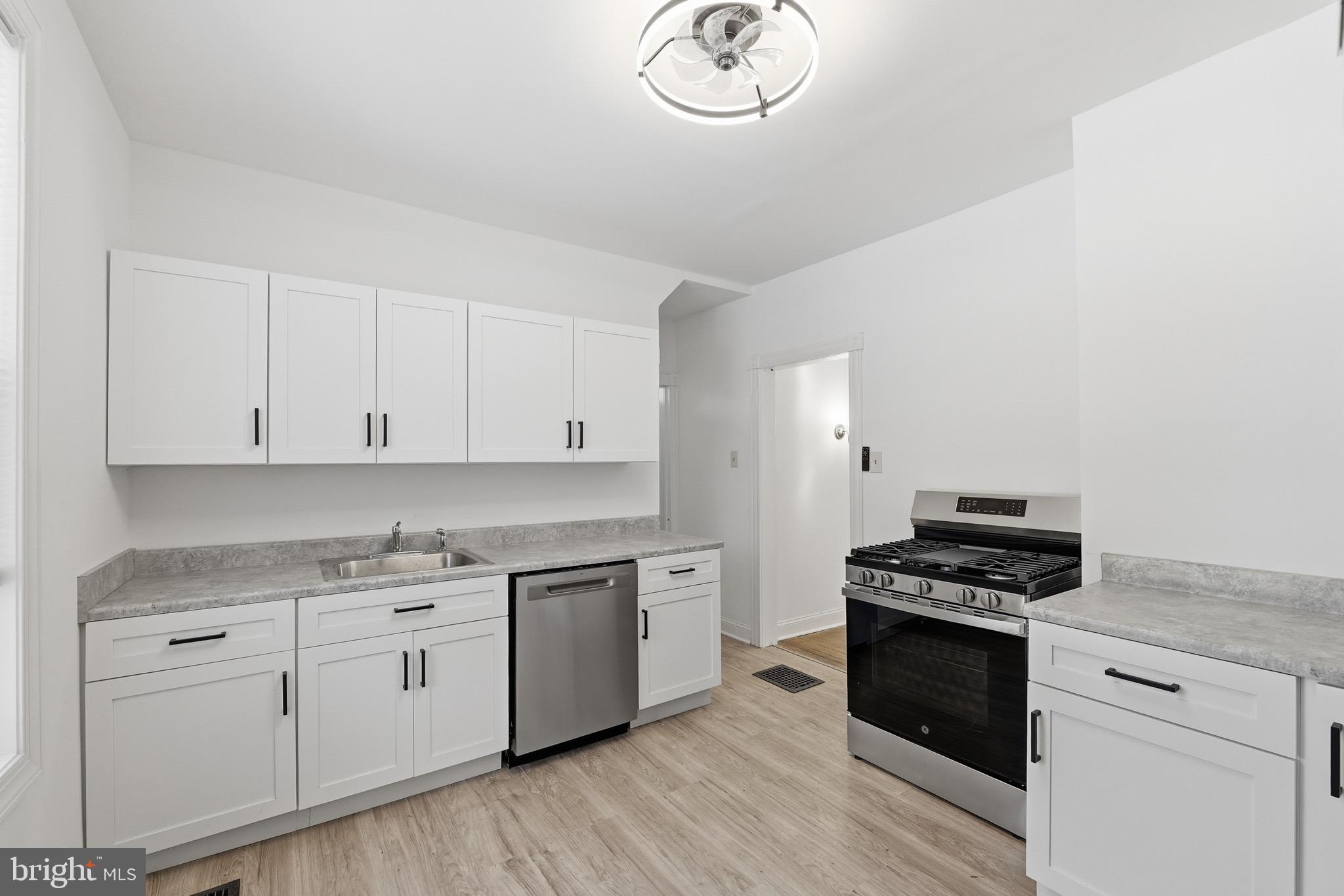 357 West 2nd Street Moorestown, NJ 08057 - Photo 22 of 23 a kitchen with white cabinets and appliances