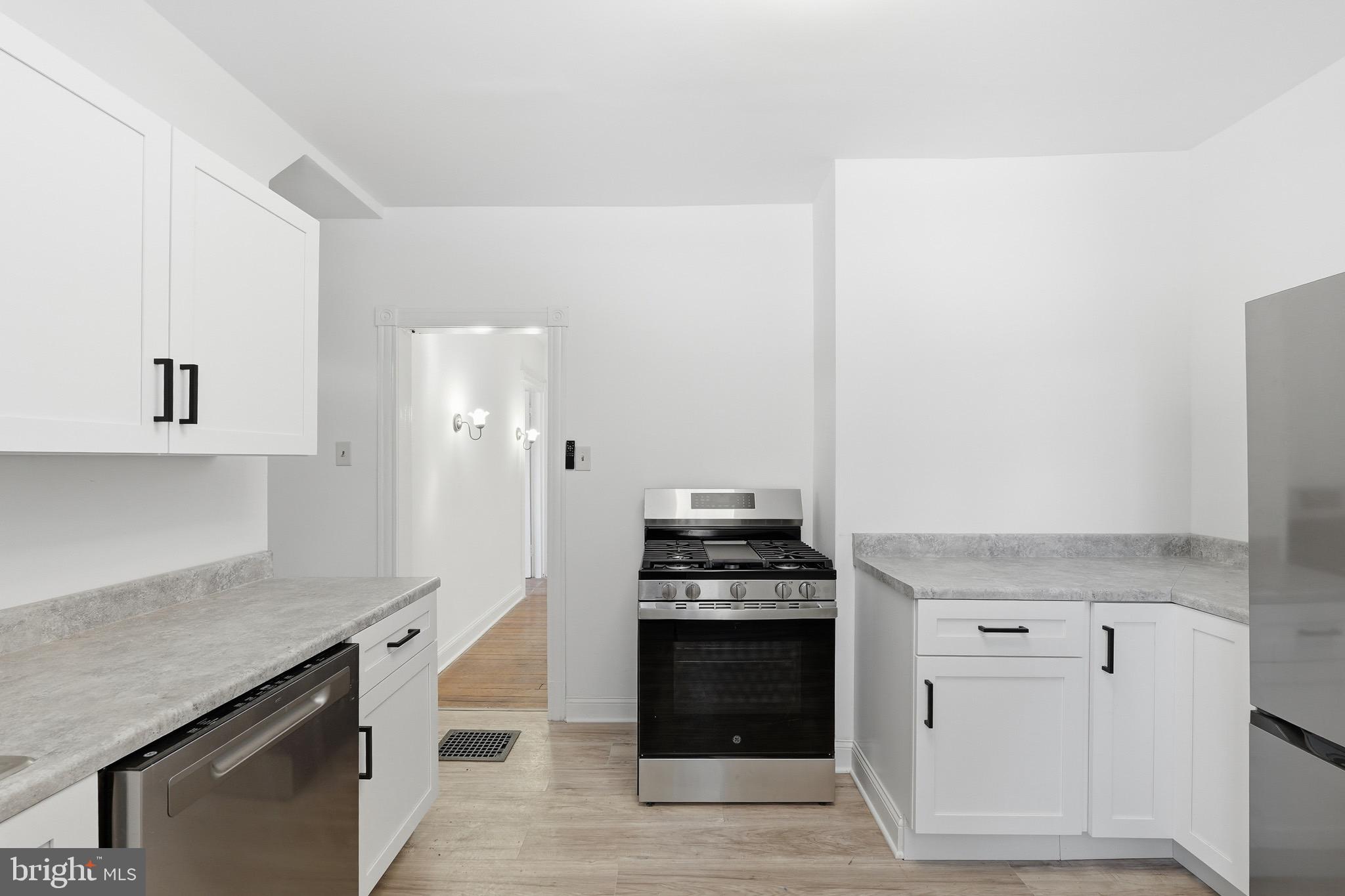 357 West 2nd Street Moorestown, NJ 08057 - Photo 23 of 23 a kitchen with stainless steel appliances a stove and a refrigerator