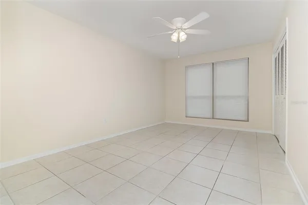 an empty room with fan