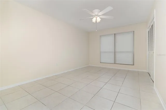 an empty room with fan