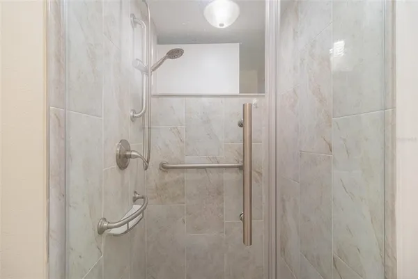 a utility room with cabinets washer and dryer