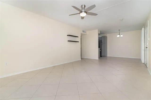 a kitchen with a refrigerator and a sink