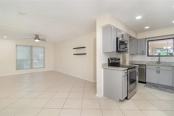 a kitchen with a sink a refrigerator and a sink