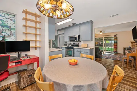 a dining room with a table and chairs