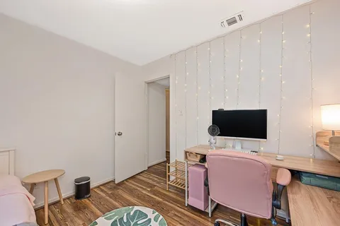 a view of a workspace with furniture