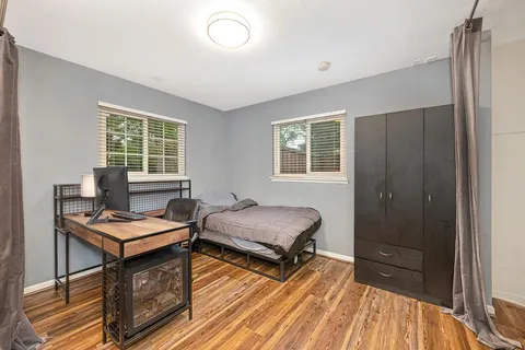 a bedroom with furniture and a window