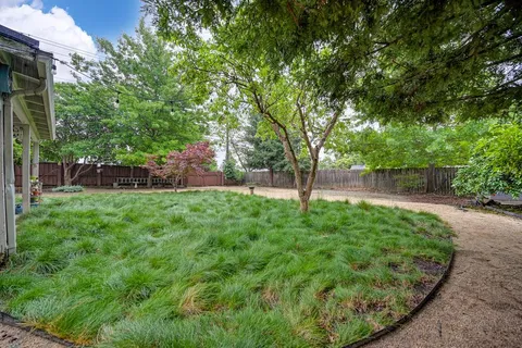 a view of a backyard with a garden
