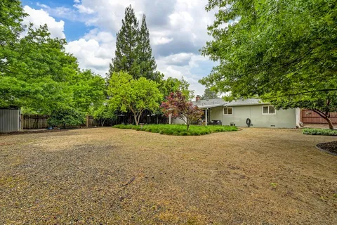 a house with a tree in front of it