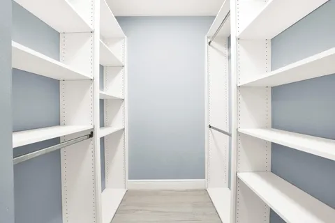 a view of an empty walk in closet