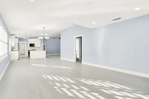 a view of a livingroom with a kitchen