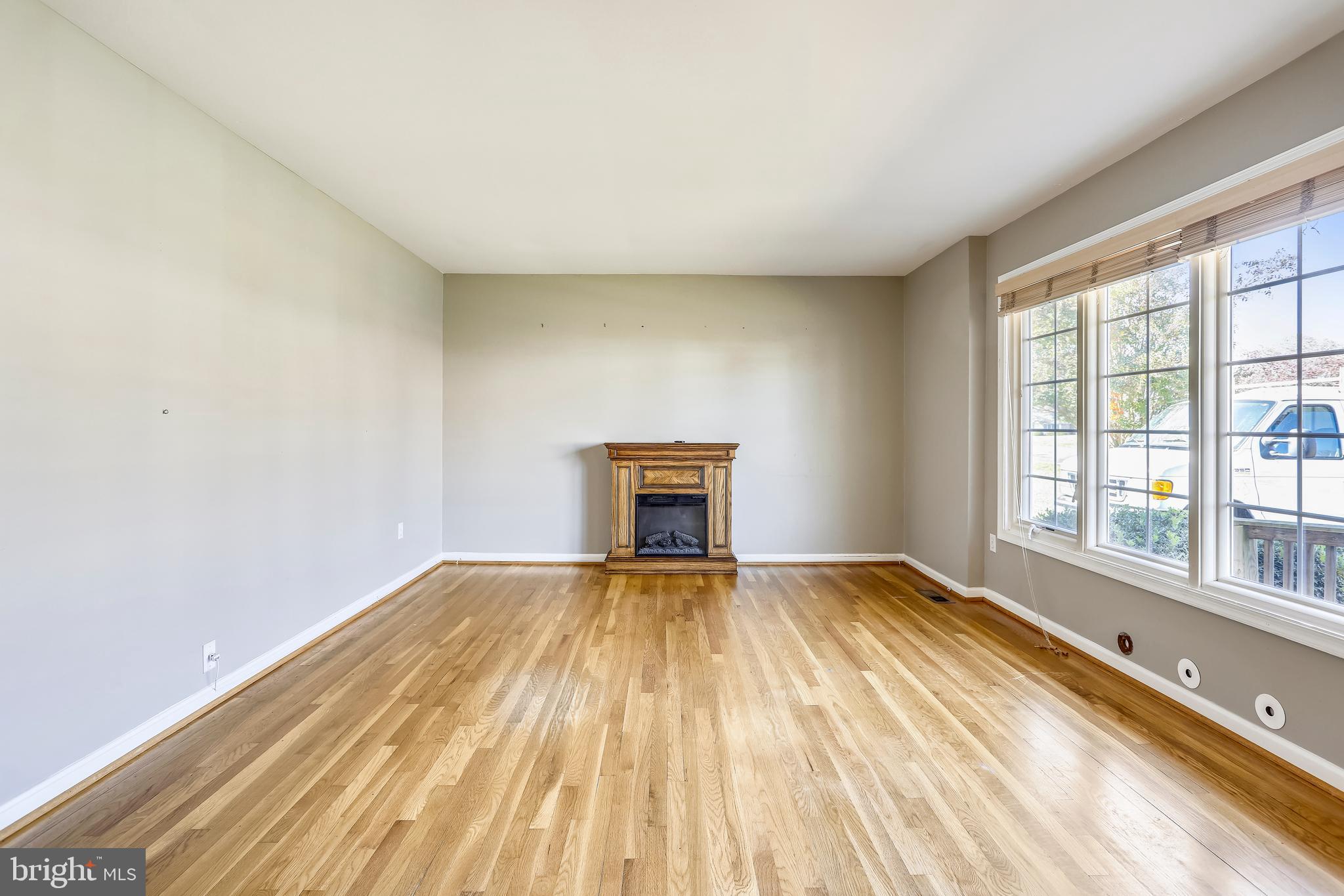 3728 Briars Road Olney, MD 20832 - Photo 10 of 54 wooden floor in an empty room with a window