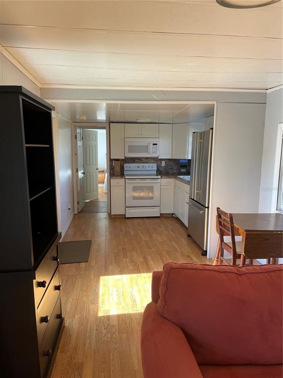 6275 Highway 441 Okeechobee, FL 34974 - Photo 4 of 18 a living room with furniture and a fireplace