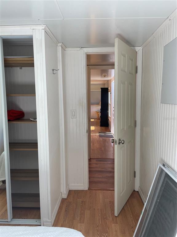 6275 Highway 441 Okeechobee, FL 34974 - Photo 6 of 18 a view of a hallway with wooden floor and closet