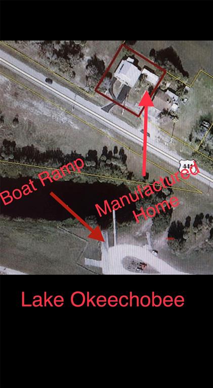 6275 Highway 441 Okeechobee, FL 34974 - Photo 7 of 18 a view of a street with a lot of trees