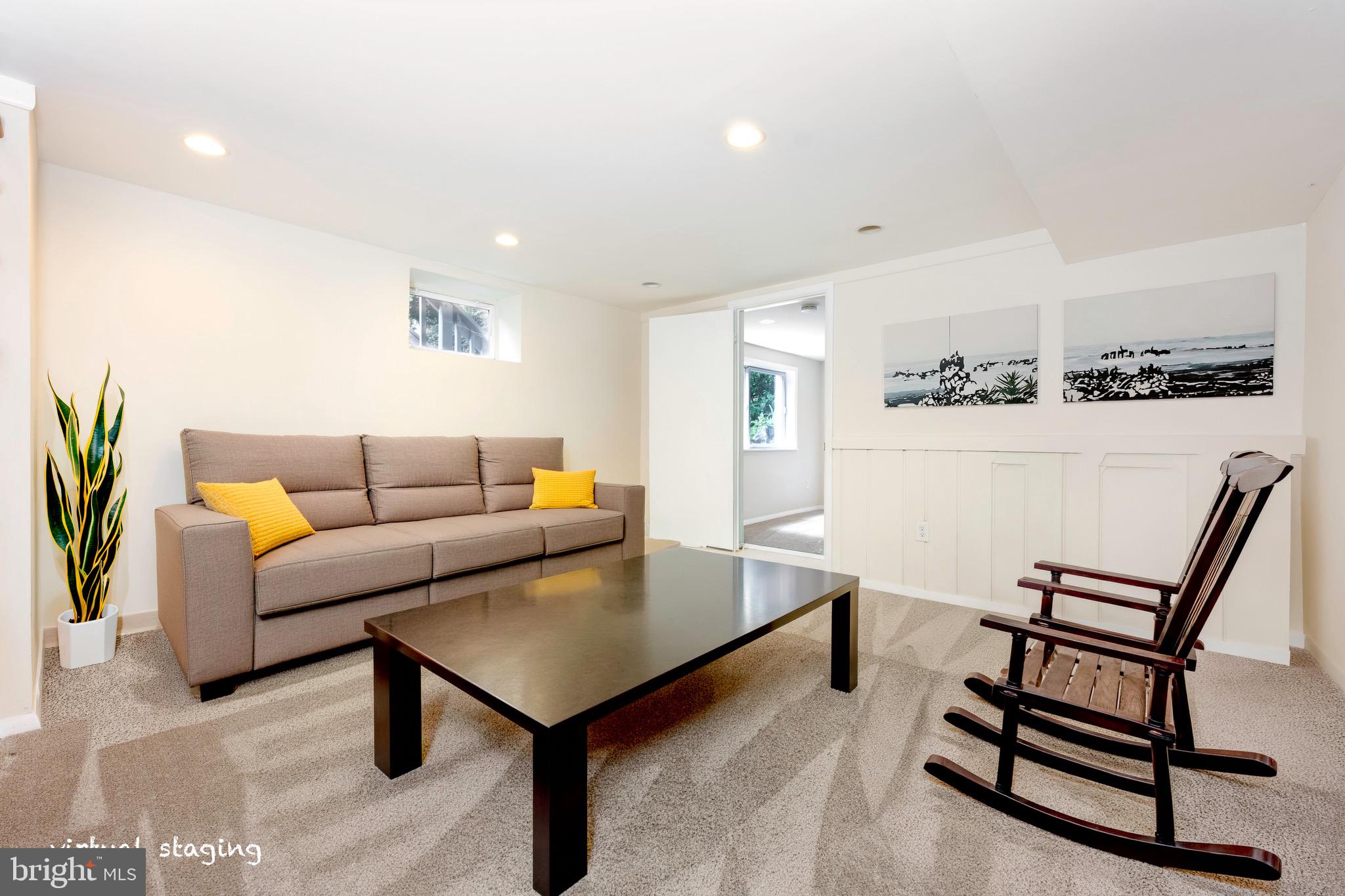 1418 Thornden Road Rockville, MD 20851 - Photo 9 of 19 a living room with furniture and a wooden floor