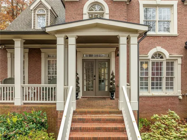 a front view of a house with a porch