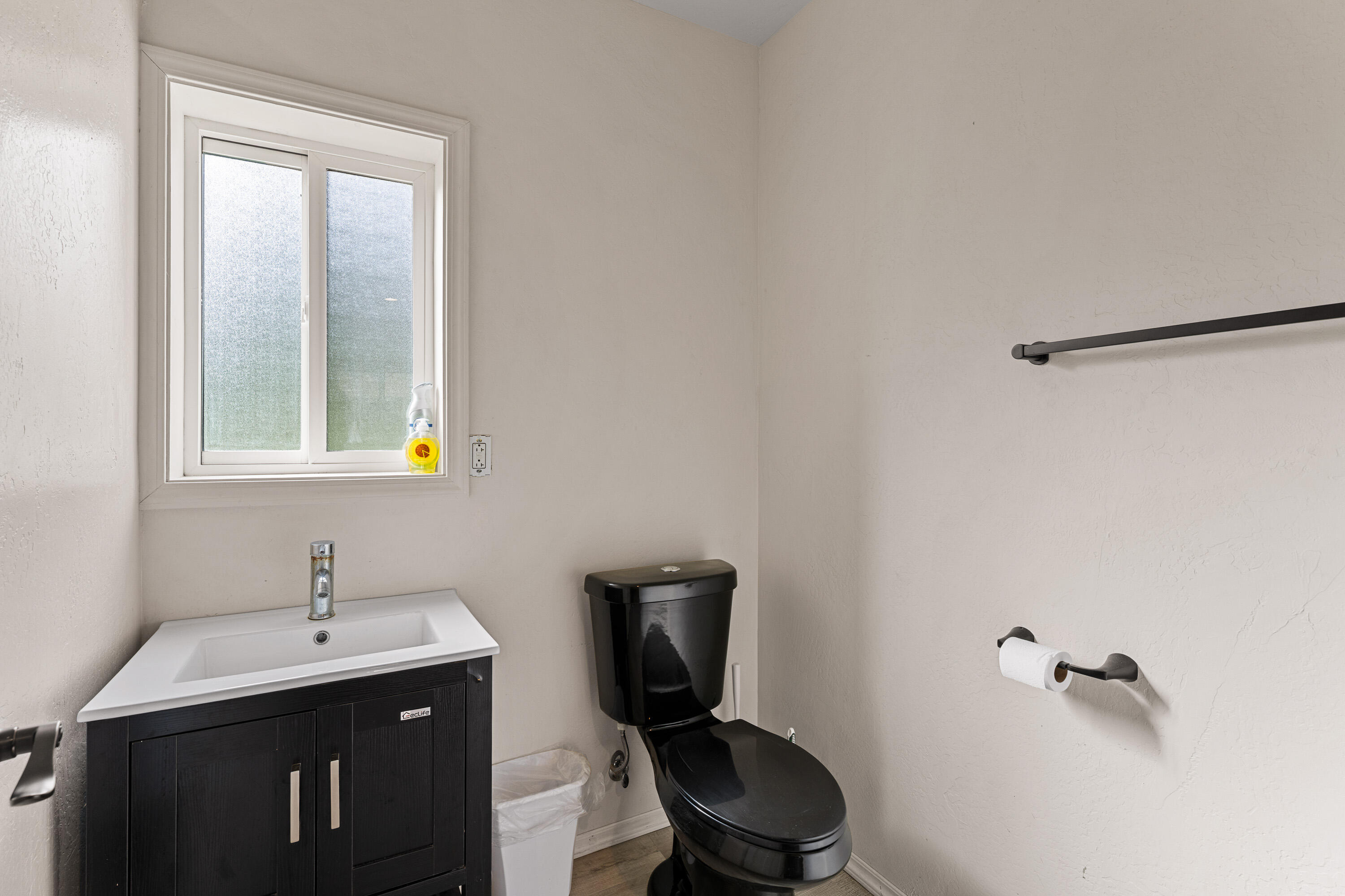 7201 Crowfoot Road Trail, OR 97541 - Photo 18 of 56 a bathroom with a toilet sink and mirror