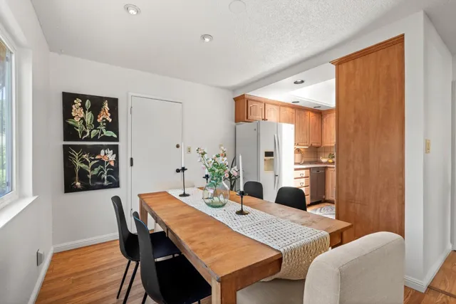 a dining room with furniture and window