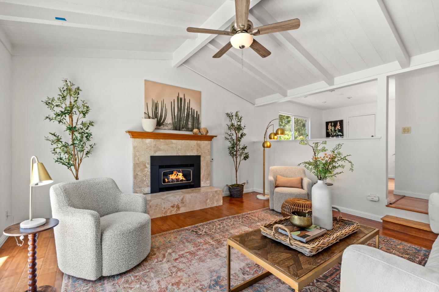 221 Segre Place Santa Cruz, CA 95060 - Photo 2 of 41 a living room with furniture a fireplace and a chandelier