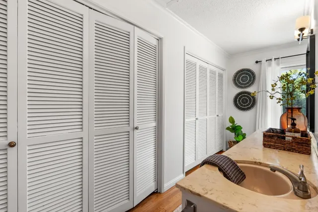 a view of a bedroom that has a bed and a window in it