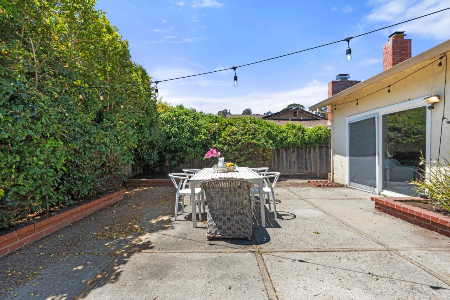 221 Segre Place Santa Cruz, CA 95060 - Photo 29 of 41 a view of a patio with a dining table and chairs