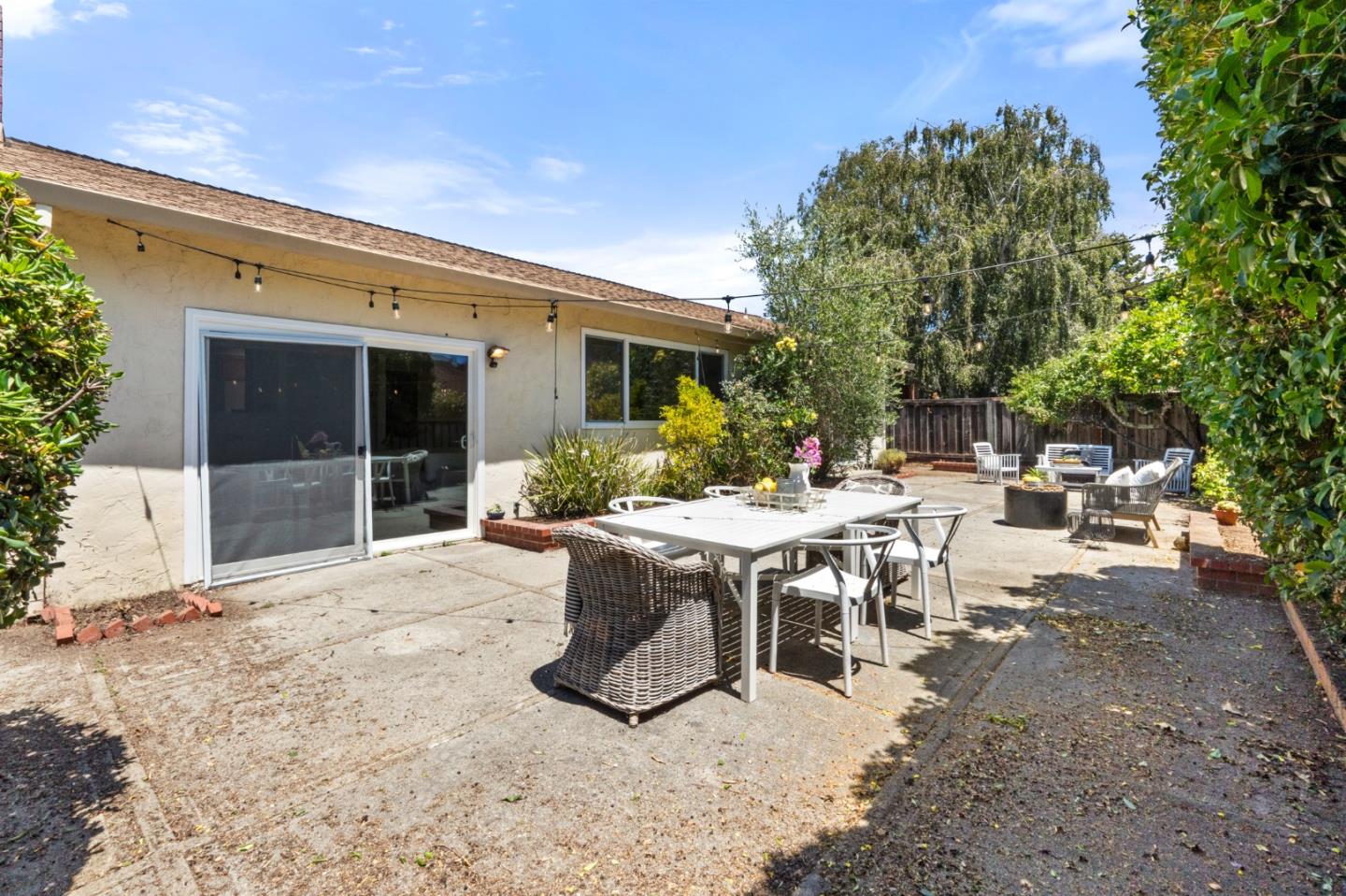 221 Segre Place Santa Cruz, CA 95060 - Photo 30 of 41 a view of a patio with table and chairs and potted plants