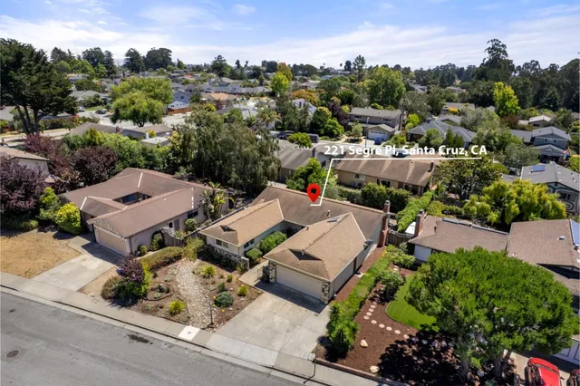 an aerial view of a house with a garden