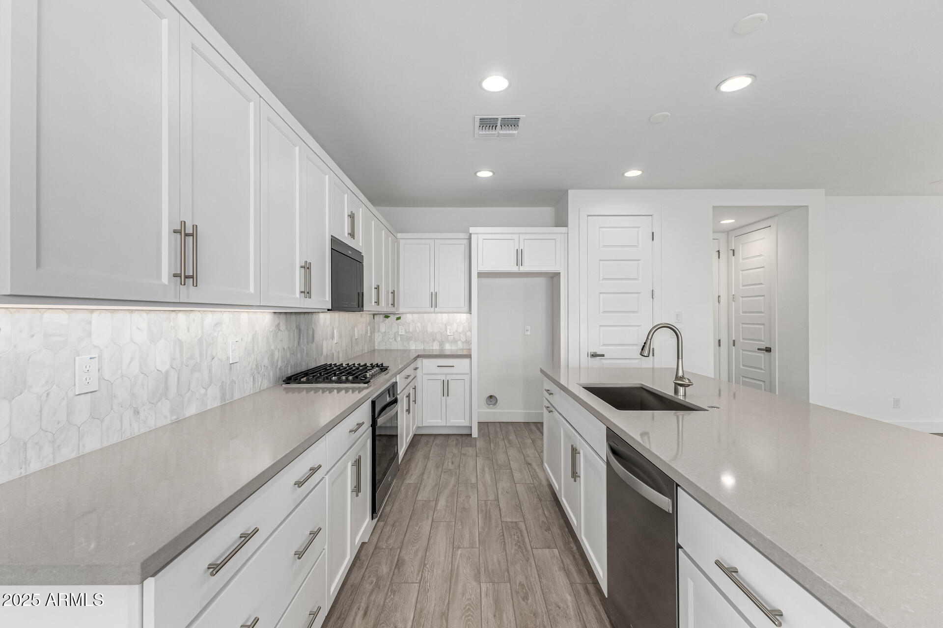 21494 East Timberline Road Queen Creek, AZ 85142 - Photo 12 of 32 a kitchen with stainless steel appliances granite countertop a sink stove and refrigerator