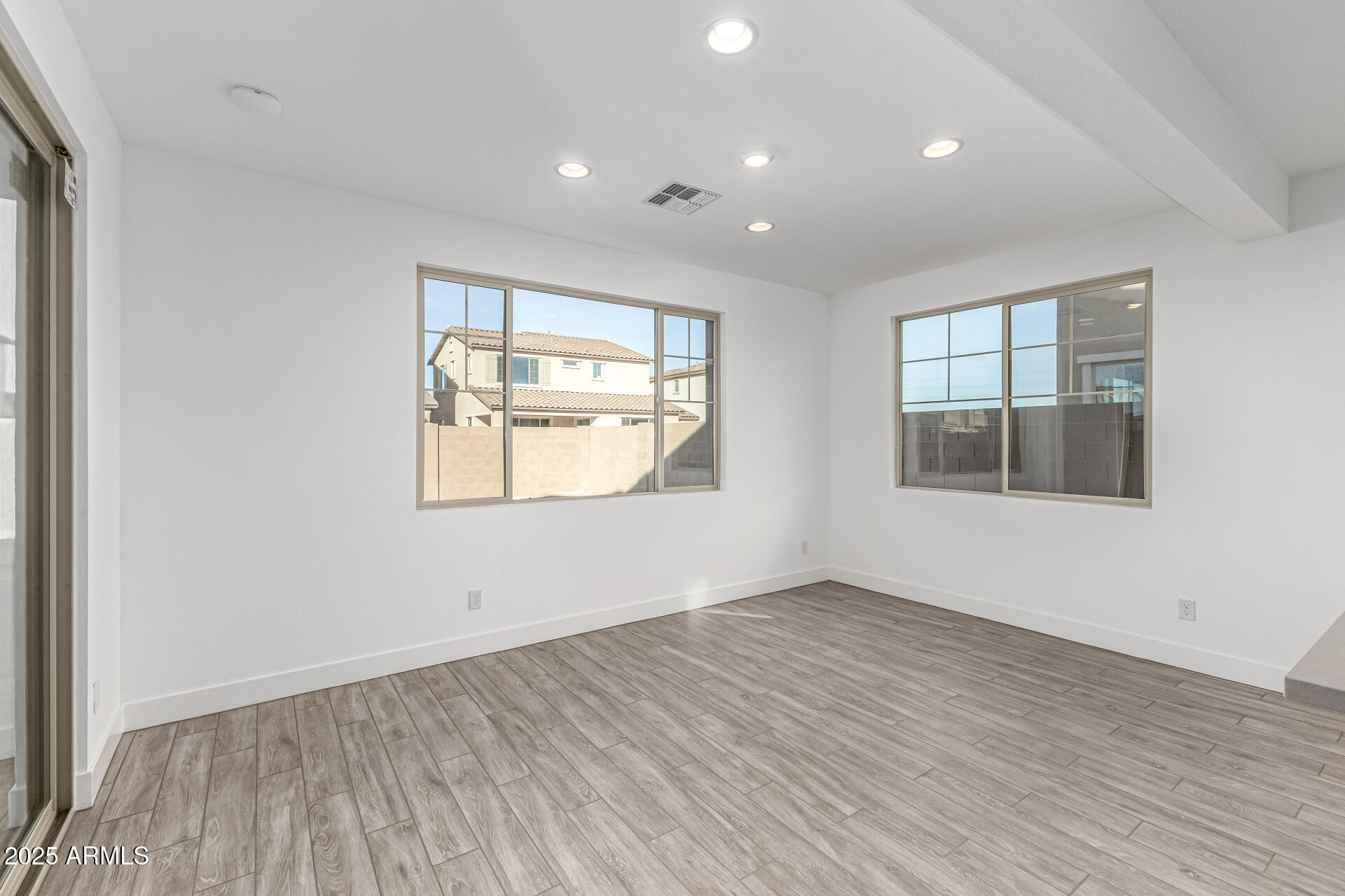 21494 East Timberline Road Queen Creek, AZ 85142 - Photo 14 of 32 an empty room with wooden floor and windows