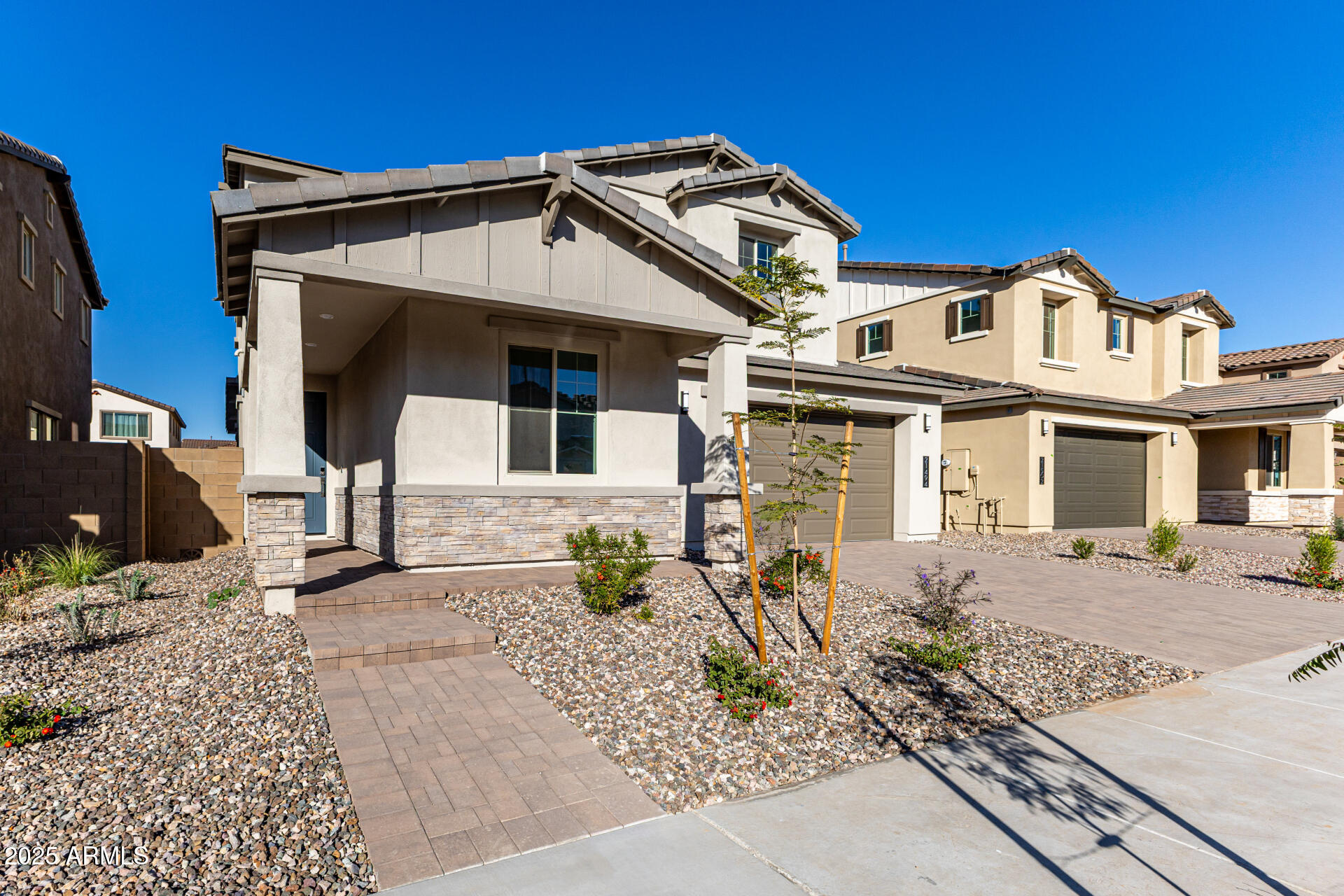 21494 East Timberline Road Queen Creek, AZ 85142 - Photo 2 of 32 a front view of a house with garden