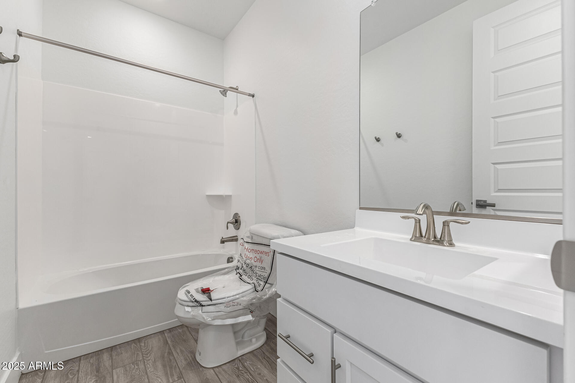 21494 East Timberline Road Queen Creek, AZ 85142 - Photo 24 of 32 a bathroom with a sink vanity mirror and toilet