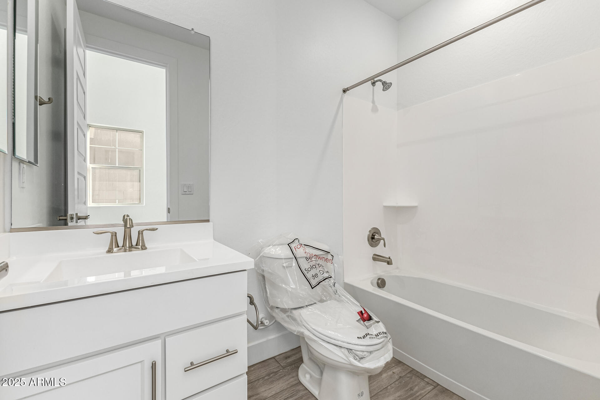 21494 East Timberline Road Queen Creek, AZ 85142 - Photo 5 of 32 a bathroom with a sink toilet vanity and tub