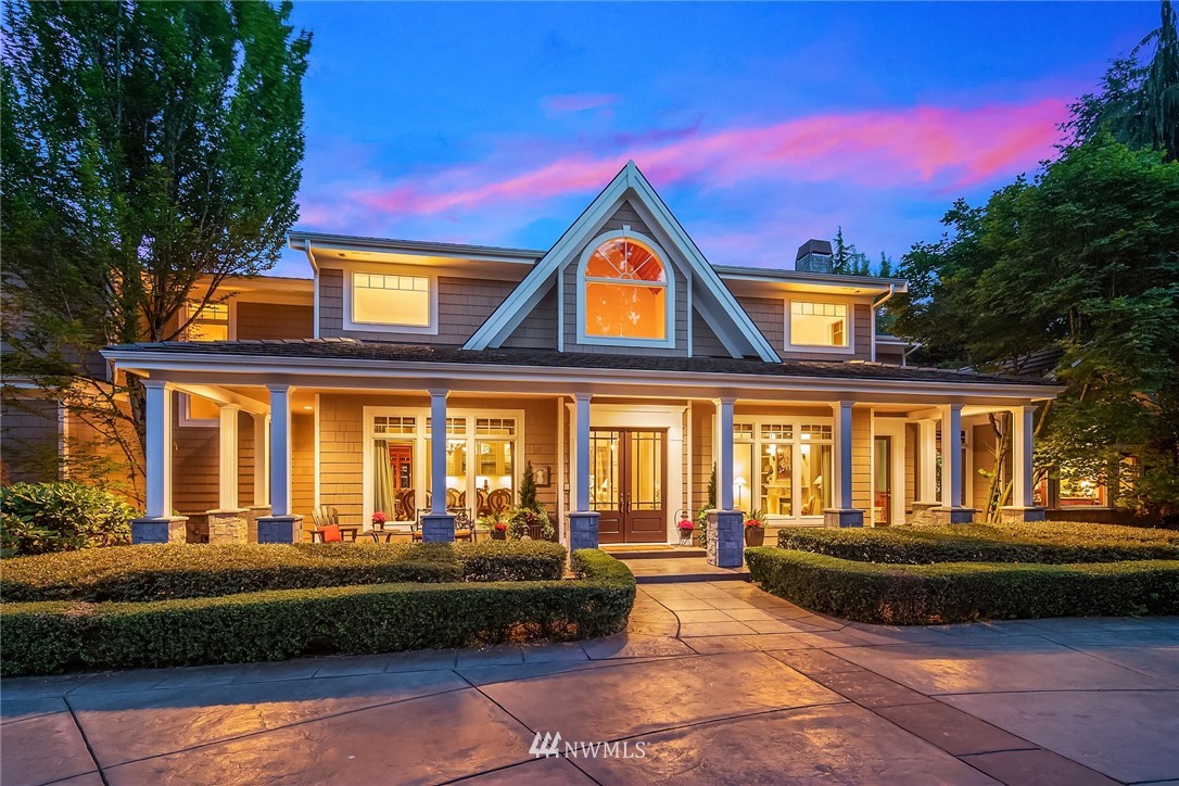 3114 220th Street Southeast Bothell, WA 98021 - Photo 2 of 39 a front view of a house with a garden