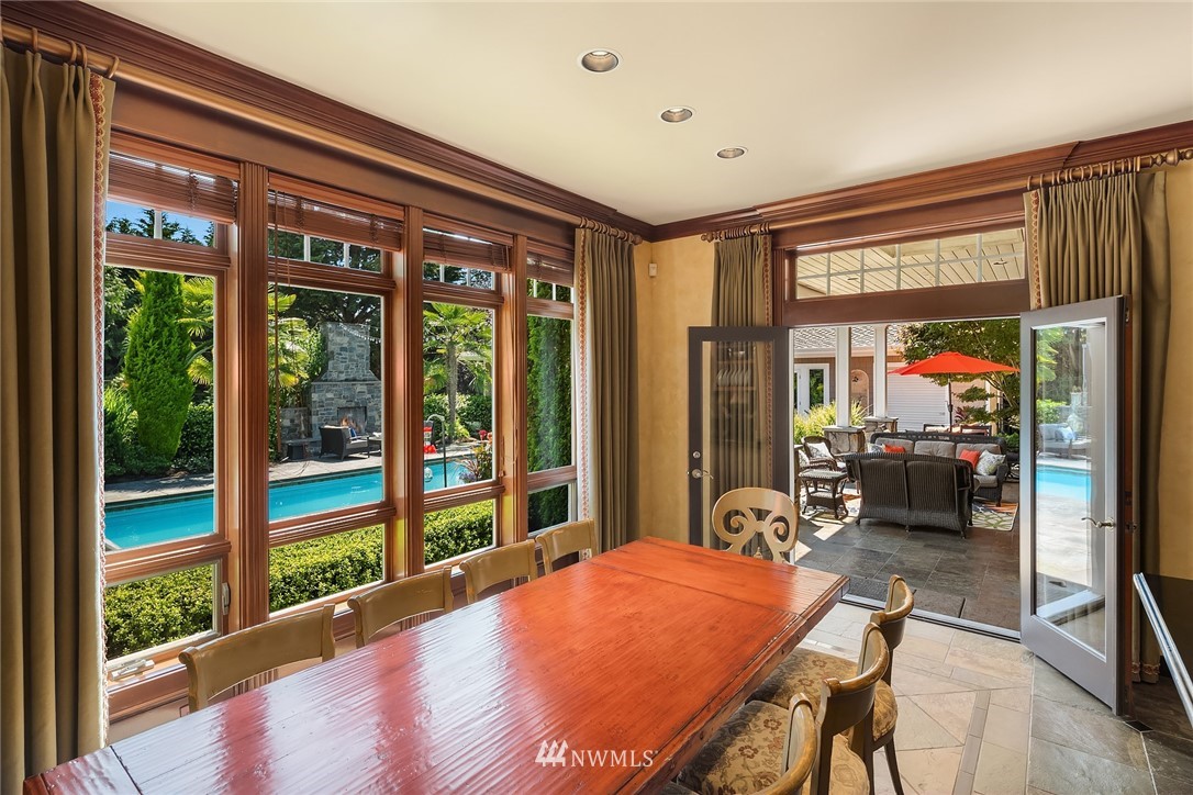 3114 220th Street Southeast Bothell, WA 98021 - Photo 17 of 39 a bedroom with furniture and large windows