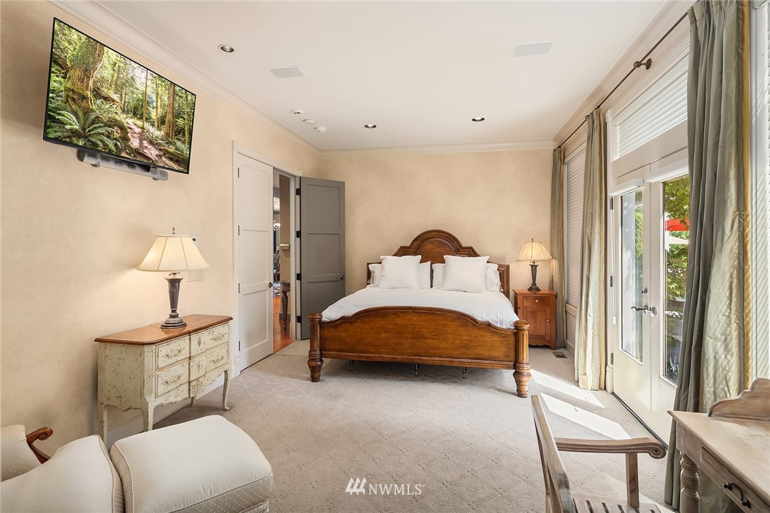 3114 220th Street Southeast Bothell, WA 98021 - Photo 18 of 39 a bedroom with a bed and a lamp