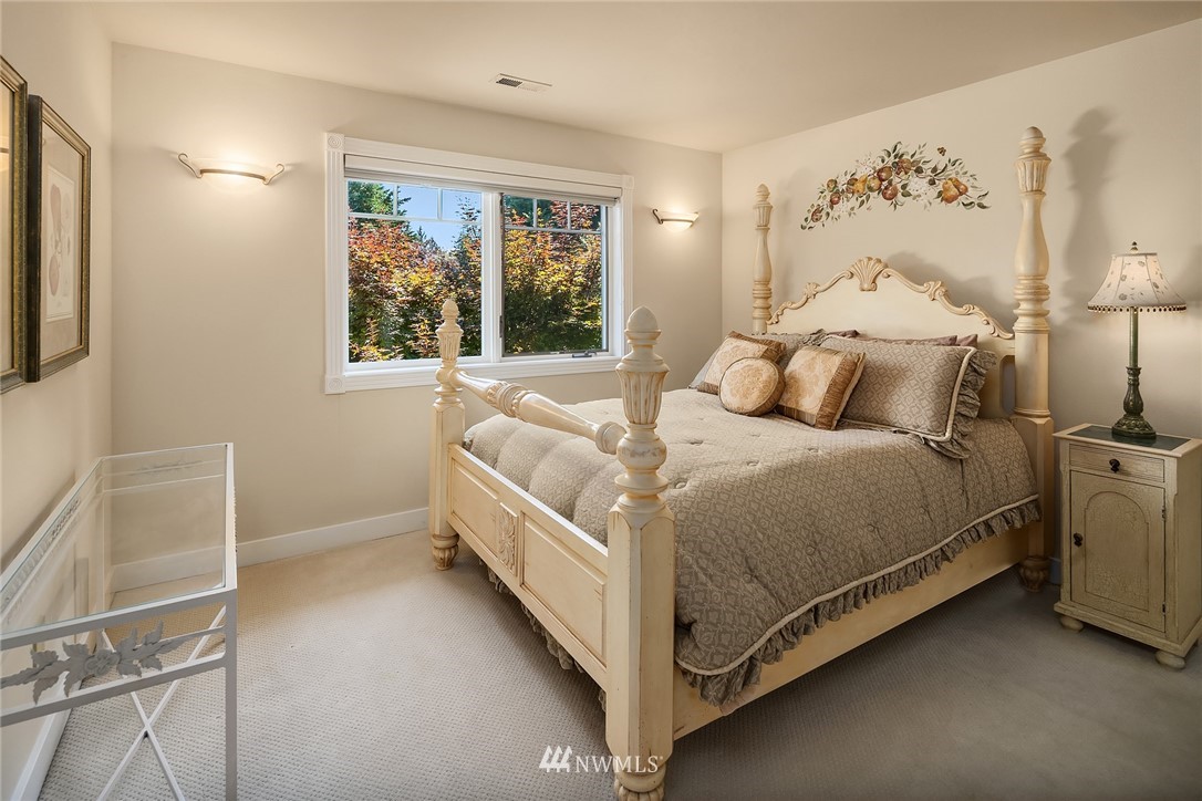 3114 220th Street Southeast Bothell, WA 98021 - Photo 21 of 39 a bed room with a bed and a window