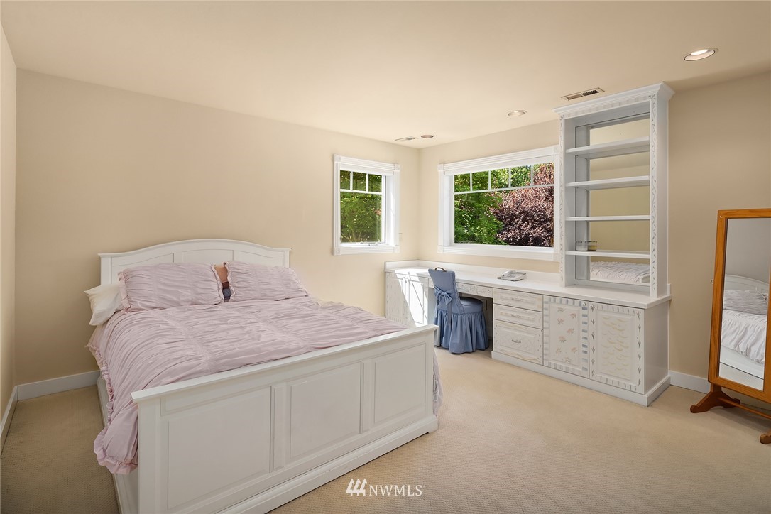 3114 220th Street Southeast Bothell, WA 98021 - Photo 23 of 39 a spacious bedroom with a bed and a large window