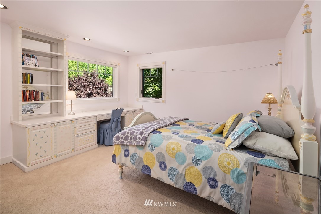 3114 220th Street Southeast Bothell, WA 98021 - Photo 25 of 39 a bedroom with a bed and a dresser