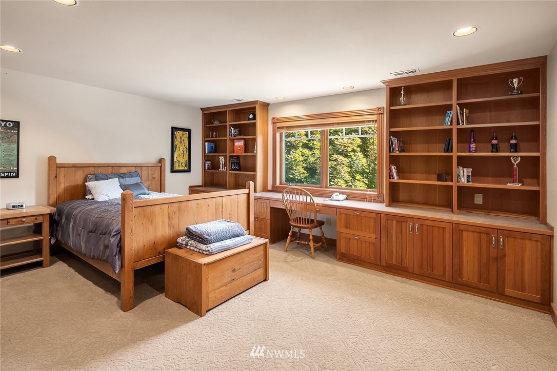 3114 220th Street Southeast Bothell, WA 98021 - Photo 27 of 39 a bedroom with a bed closet and window
