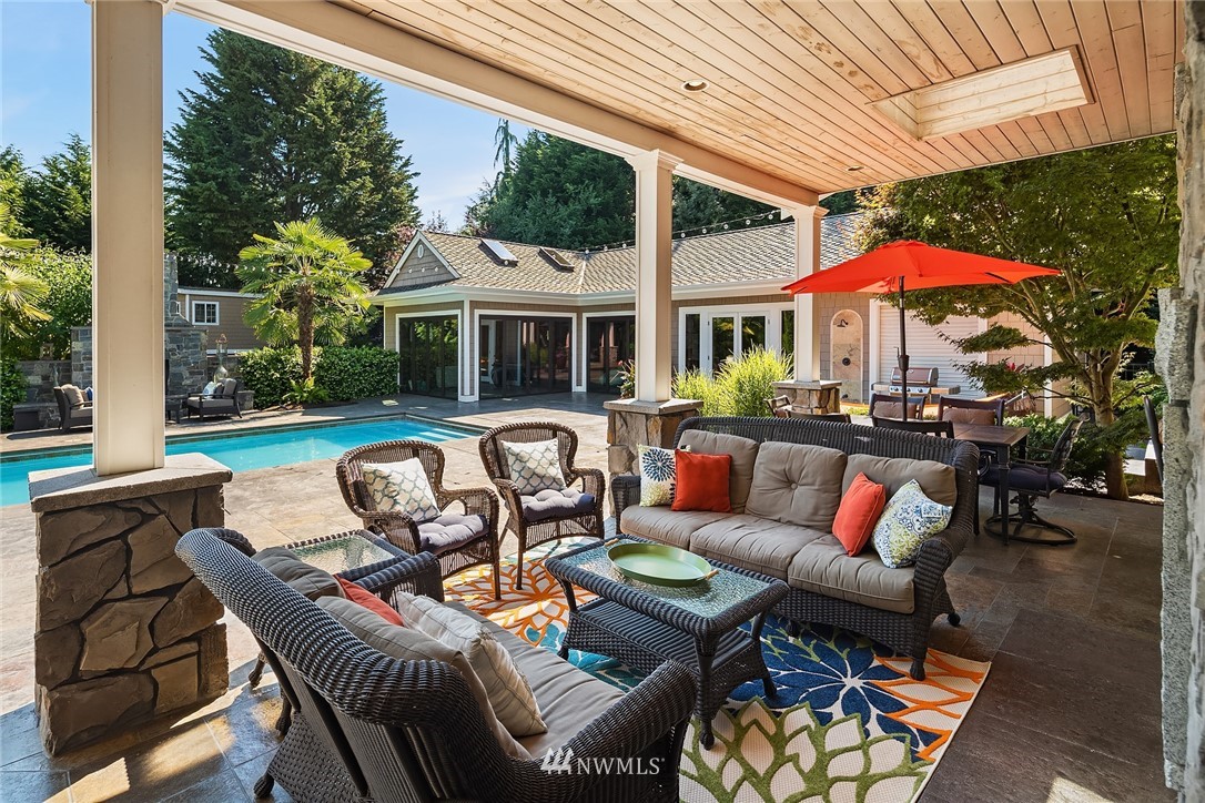 3114 220th Street Southeast Bothell, WA 98021 - Photo 28 of 39 a backyard of a house with table and chairs