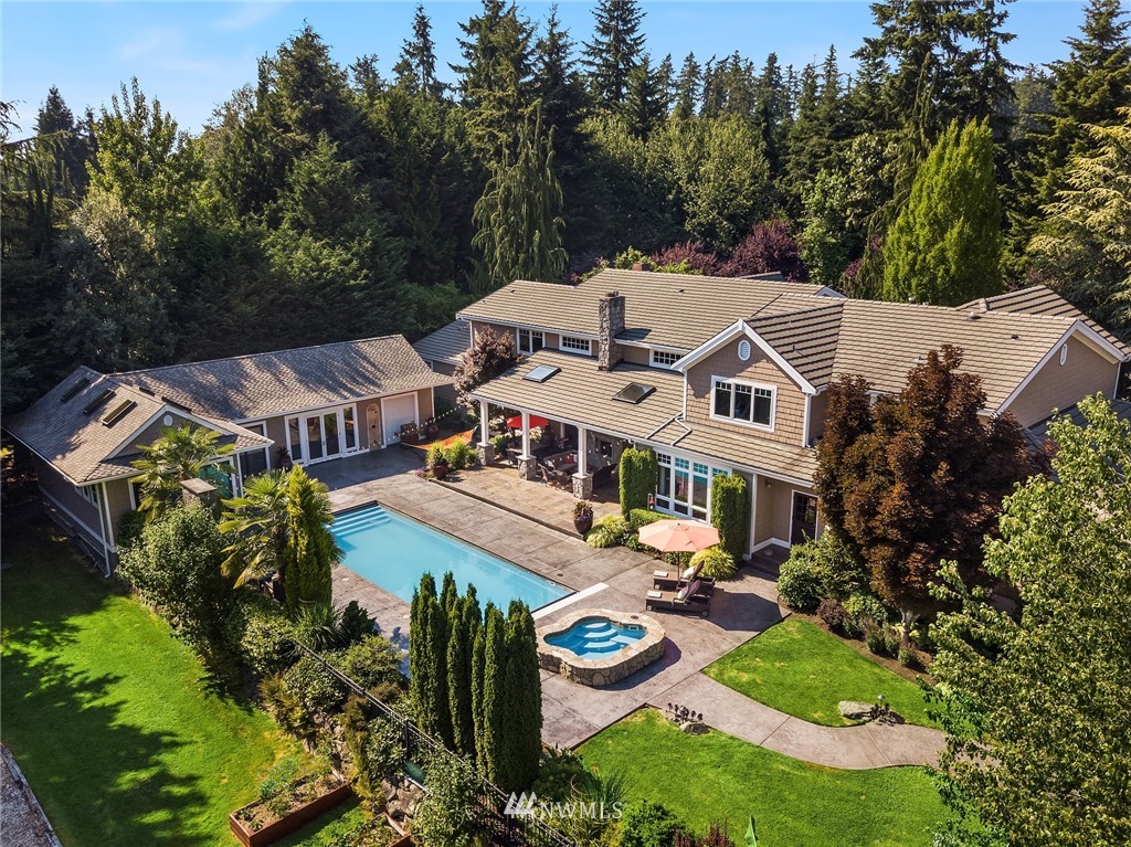 3114 220th Street Southeast Bothell, WA 98021 - Photo 4 of 39 an aerial view of a house with swimming pool and big yard