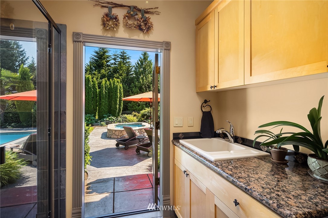 3114 220th Street Southeast Bothell, WA 98021 - Photo 32 of 39 a view of a kitchen and living room