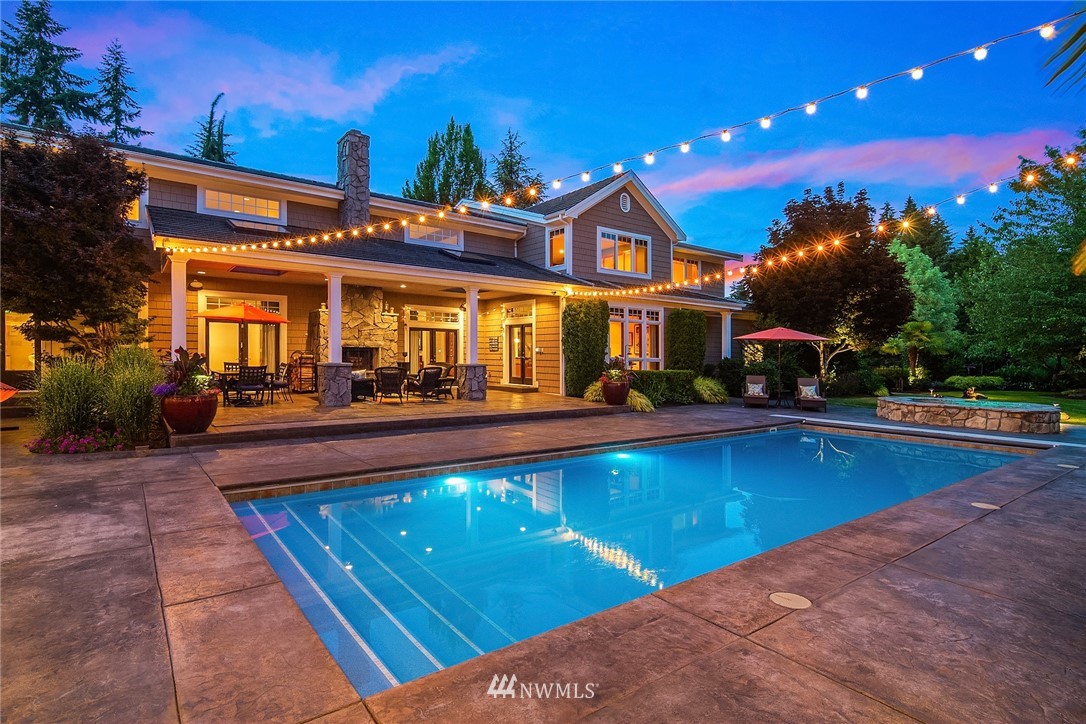 3114 220th Street Southeast Bothell, WA 98021 - Photo 37 of 39 a view of a house with swimming pool and sitting area