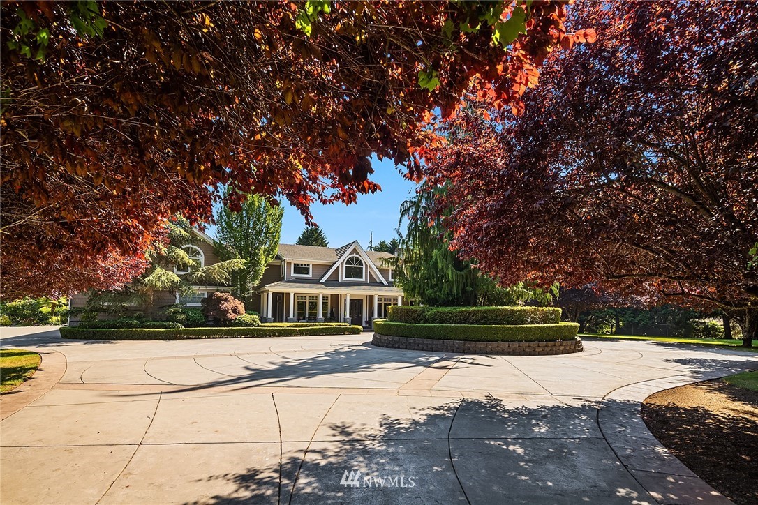3114 220th Street Southeast Bothell, WA 98021 - Photo 5 of 39 a front view of a house with a yard