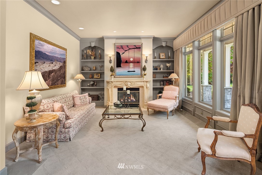 3114 220th Street Southeast Bothell, WA 98021 - Photo 8 of 39 a living room with furniture a flat screen tv and a fireplace