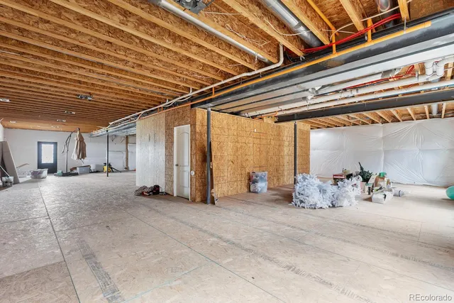 a view of a house with a garden and lake view