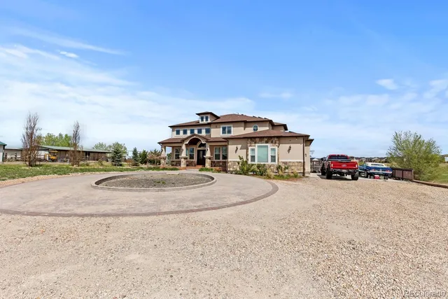 a view of entryway and hall with a front door