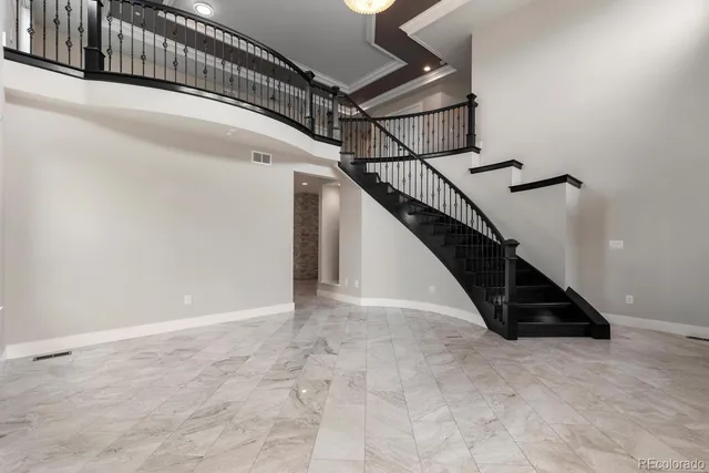 a large kitchen with stainless steel appliances granite countertop a sink and cabinets
