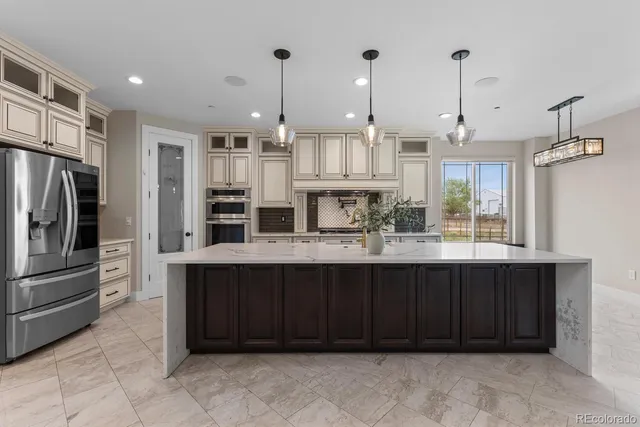 a bathroom with double vanity sink a bathtub and mirror